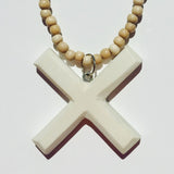 White Kiss Pendant on Natural Necklace